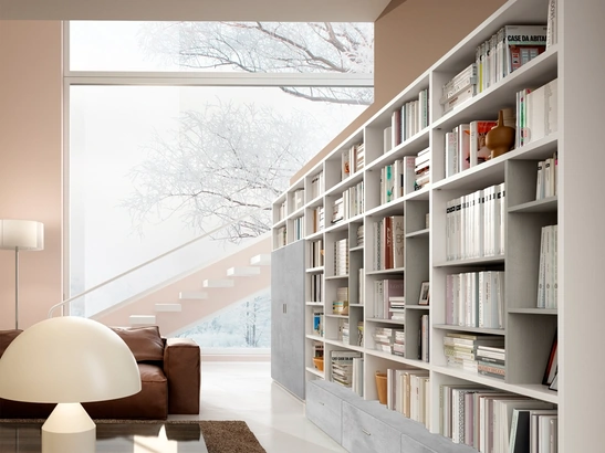 Libreria a muro Living 78D con vani a giorno e ante in materico effetto cemento di Ferrimobili